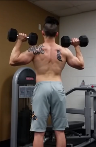 Handstandpushup.com Beginner Handstand Push Up Guide Standing military press with dumbbells start position