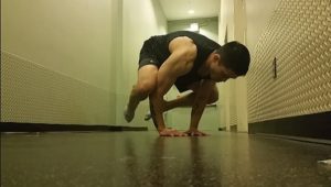 Handstandpushup.com Intermediate Handstand Push Up Guide bent arm pose knees tucked middle position