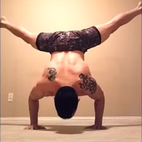 Handstandpushup.com Hanstand push-up shoulder exercises bent arm stand with straddled legs 3