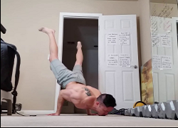 handstandpushup.com handstand push-up home workouts 90 degree handstand push-up with straight legs combination grey shorts