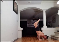 handstandpushup.com handstand push-up home workouts handstand push-ups with bent knees side view black shorts