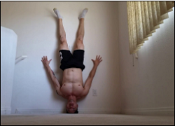 handstandpushup.com handstand push-up home workouts headstand handstand push-up black shorts