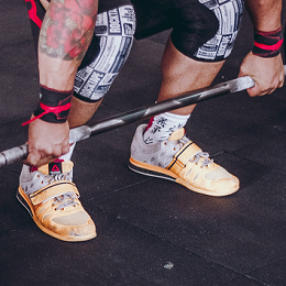 Handstandpushup.com mens handstand workout cross training shoes athlete in reebok crossfit orange shoes