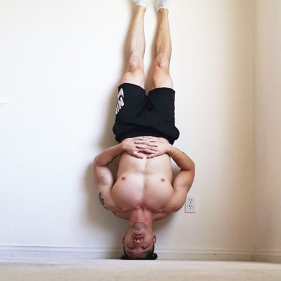 handstandpushupcom supplements for athletes kerry don headstand against white wall